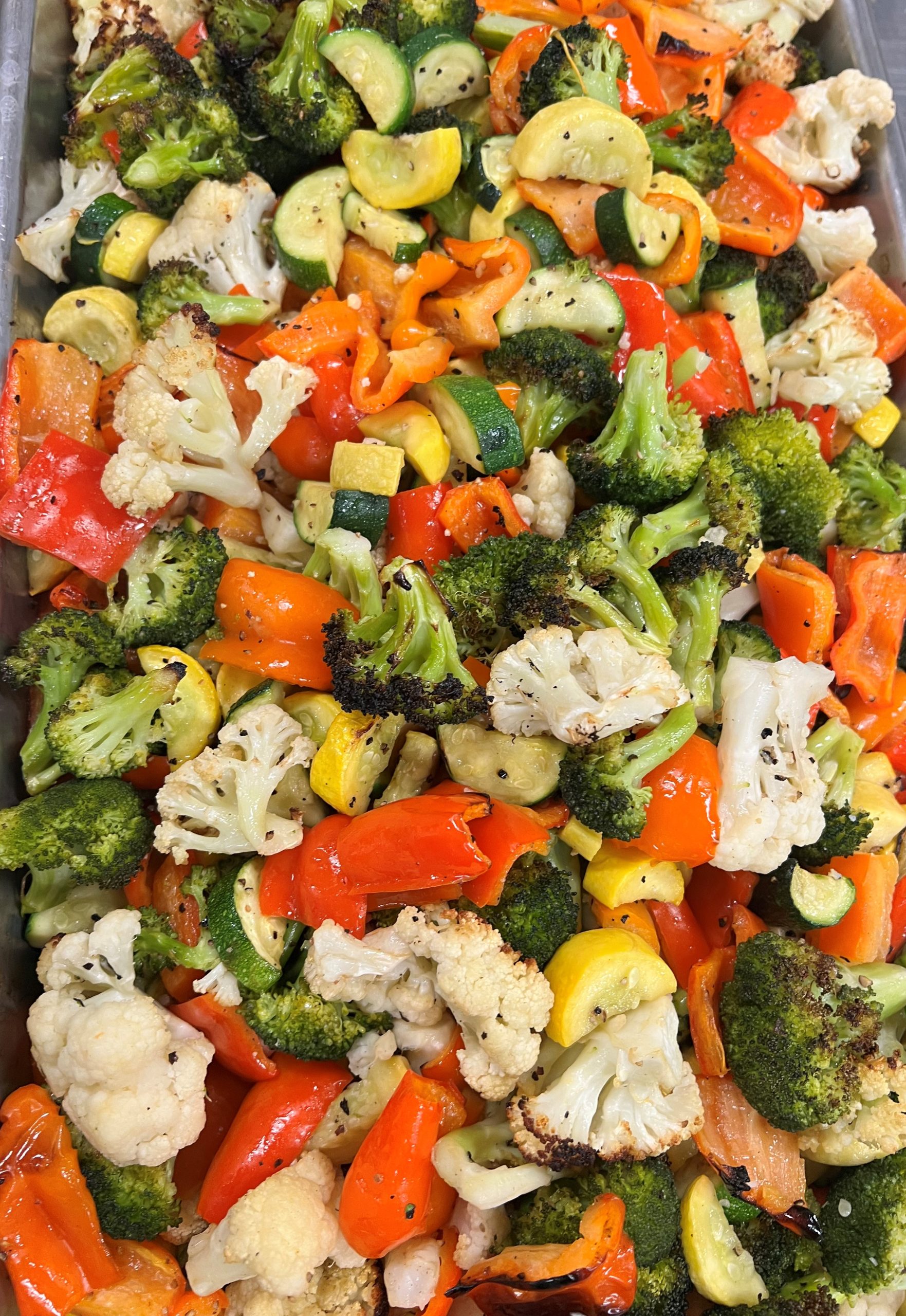 A pan full of vegetables on a table.